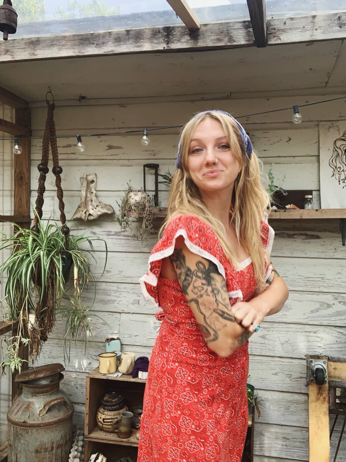 Chef Hannah Slattery in a red dress in her garden kitchen